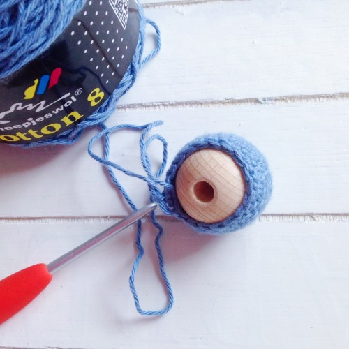 (DEC, 2 SC) x 6 (18 STS).  Make sure the bead is inserted here and continue working around it.