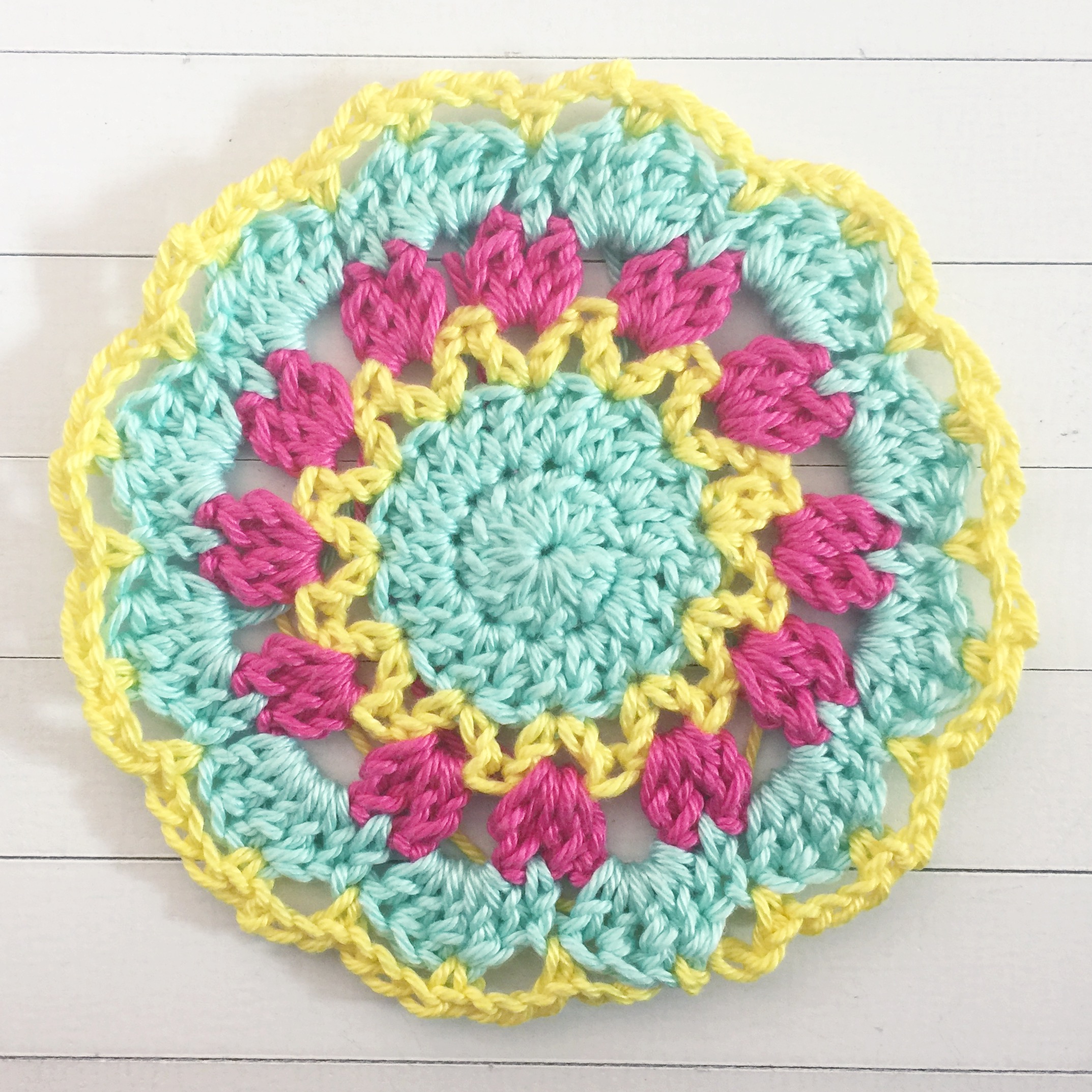 Join next colour to the top of any HDC with an SC (single crochet). CH3, sc into the Tr from the previous round. CH3, sc into the next HDC. Repeat this around, SS to join.